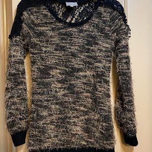 Lupruia Sexy Sweater with black lace details in the back.